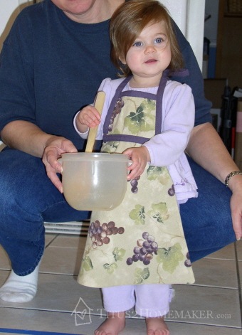 Sophia in her apron, with Grandma #t2hmkr