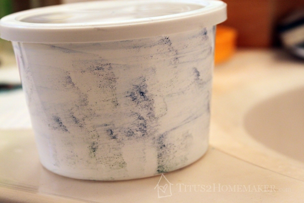 sour cream container midway through "erasure" t2hmkr